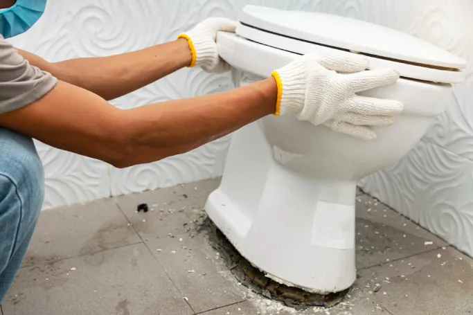 plumber-fixing-toilet